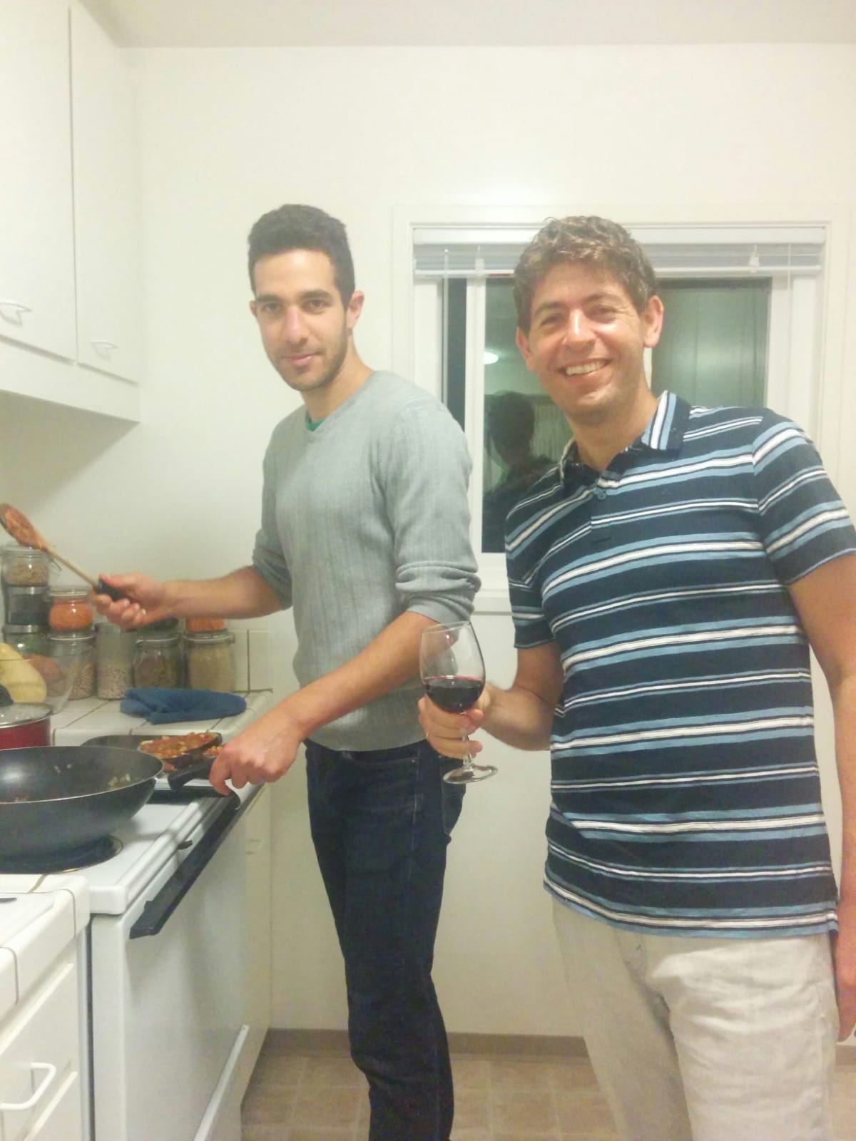 Erez and Arik cooking dinner